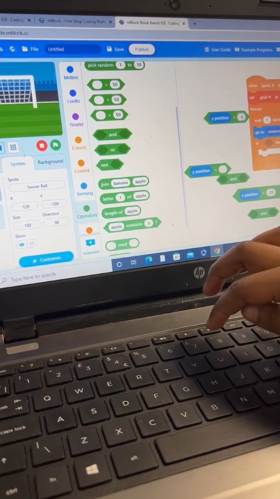 Close-up of block coding software on a laptop