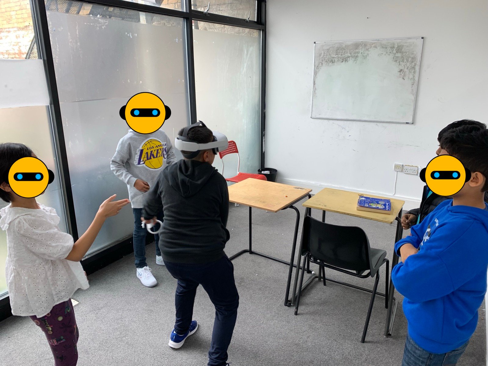 Children trying a VR activity during a technology session
